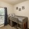 Large well lit bedroom with plush carpets and large windows 